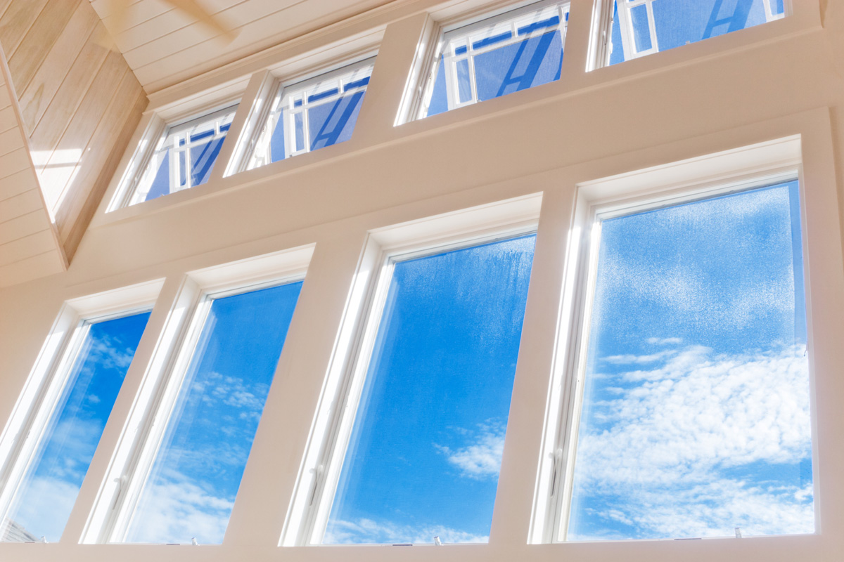 Windows in a house showing a blue sky outside in Euclid.